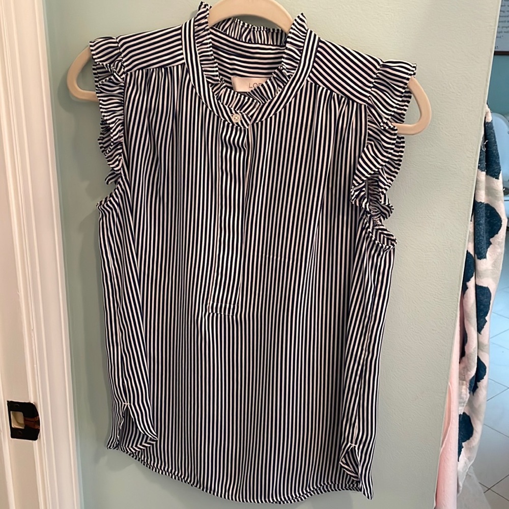 Loft sleeveless blue and white striped blouse with ruffles at sleeves and neck.